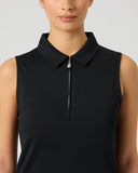 A sleeveless black polo-style top with a half-zip collar, shown on a model against a light gray studio background.