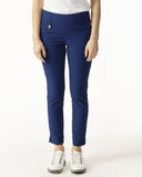 Person wearing blue pants and white shoes on a white background