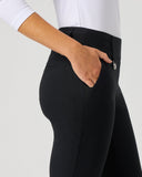 Person wearing black pants with a white background