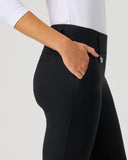 Person wearing black pants with a white background