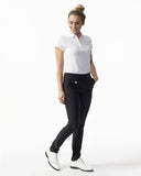 Woman wearing a white shirt and black pants on a white background