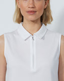 Woman wearing a white sleeveless top with a zipper on a plain background