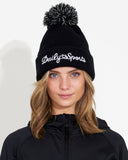Person wearing a black beanie with 'Daily Sports' logo on a white background