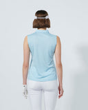 Person wearing a light blue sleeveless top and white pants on a plain background