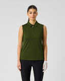 A woman modeling a sleeveless olive green polo shirt with a half-zip collar, paired with black pants and a white glove, against a light gray studio background.
