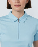 Light blue polo shirt worn by a person on a white background