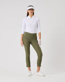 Woman wearing a white shirt, green pants, and a visor on a white background