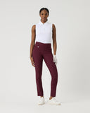 Person wearing a white shirt and burgundy pants on a white background