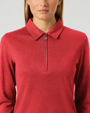 A woman wearing a red long-sleeve quarter-zip polo shirt, shown from the nose down against a light gray studio background.