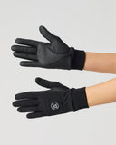 Black athletic gloves worn on a model's hands against a light gray studio background. One glove is shown on the back of the hand and the other on the palm side, featuring a small circular logo near the cuff.