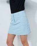 Light blue skirt worn by a person on a plain background