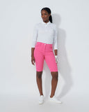 Person wearing a white shirt and pink pants on a white background