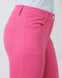Close-up of bright pink pants on a white background