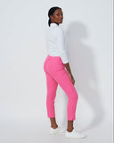 Person wearing pink pants and a white shirt on a plain background