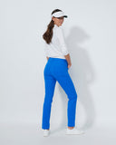 Woman wearing a white shirt, blue pants, and a visor on a white background