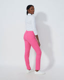 Person wearing a white top and pink pants on a white background