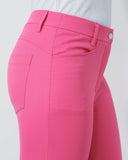 Close-up of bright pink pants on a white background
