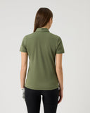 Person wearing a green polo shirt on a plain background