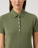 Green polo shirt worn by a person on a light gray background