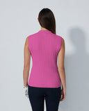 Person wearing a pink sleeveless top against a plain background