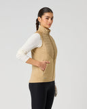 Daily Sports Allos Bark Hybrid Vest in warm camel tan – women's hybrid golf vest side view showing zip side pocket and quilted-to-fleece panel transition detail