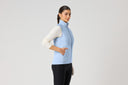 Daily Sports Allos Light Blue Hybrid Vest in soft powder blue – women's hybrid golf vest side view showing zip side pocket and quilted-to-fleece panel transition detail