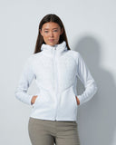 Person wearing a white jacket against a light gray background