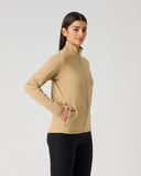 Daily Sports Cholet Full Zip Midlayer Jacket in warm camel bark – women's fleece golf jacket side view showing zip hand pocket, silver zipper pull and fitted wais