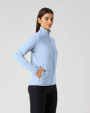 Daily Sports Cholet Light Blue Full Zip Midlayer Jacket in soft powder blue – women's fleece golf jacket side view showing zip hand pocket, lime green zipper pull and fitted waist
