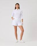 Person wearing a white outfit on a plain background