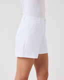 White shorts worn by a person on a light gray background