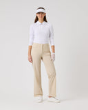 Person wearing a white polo shirt, beige pants, and a visor on a white background