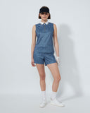 Person wearing a blue patterned outfit on a white background