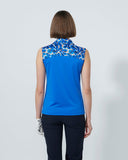 Woman wearing a blue sleeveless top with floral pattern on a white background