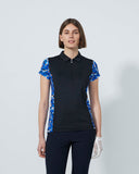 Person wearing a black polo shirt with blue floral sleeves on a white background