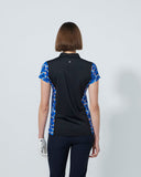 Woman wearing a black shirt with blue floral sleeves on a white background