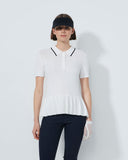 Woman wearing a white polo shirt with black trim on a light gray background