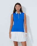 Woman wearing a blue sleeveless top and white skirt on a white background