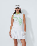 Woman wearing a white tennis dress with green accents on a white background