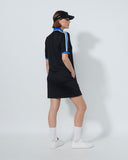 Person wearing a black outfit with blue accents on a white background