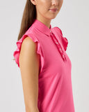 Woman wearing a pink blouse with ruffled details on a light gray background