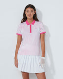 Woman wearing a white and pink striped dress with a collar on a white background
