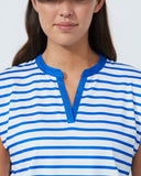 Woman wearing a blue and white striped shirt against a plain background