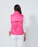 Person wearing a pink vest on a white background