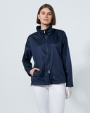 Woman wearing a navy raincoat on a white background