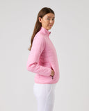 Woman wearing a pink jacket on a plain background