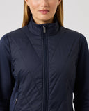 Navy blue jacket worn by a person on a light gray background