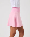 Pink skirt worn by a person on a plain background