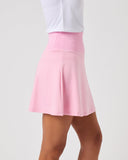 Pink skirt worn by a person on a plain background