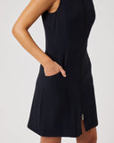 Black sleeveless dress worn by a person on a plain background
